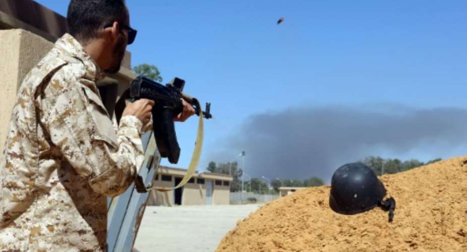 A fighter loyal to the internationally recognised government in Tripoli holds a position south of the capital as forces under commander Khalifa Haftar set their sights on taking the capital.  By Mahmud TURKIA AFPFile
