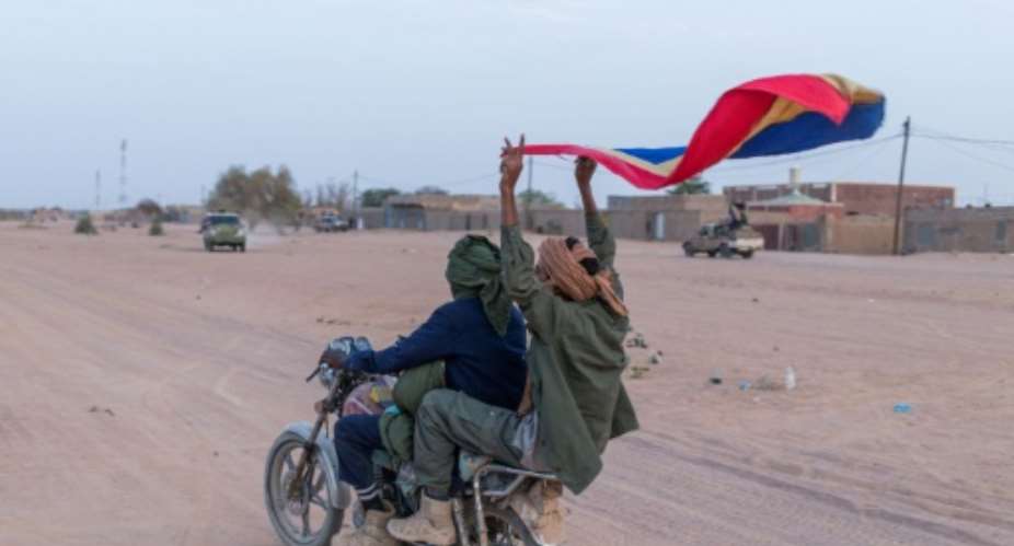 A fighter with a flag of the FLA Tuareg separatist group in northern Mali.  By - (AFP/File)