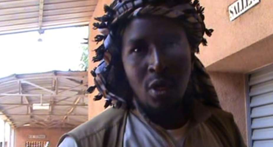 A file grab taken from a video shows Aliou Mahamar Toure, a member of Al-Qaeda offshoot MUJAO, who is on trial for alleged atrocities committed when he was the head of an Islamic police brigade deployed by jihadists in the northern Mali city of Gao..  By - AFPFile