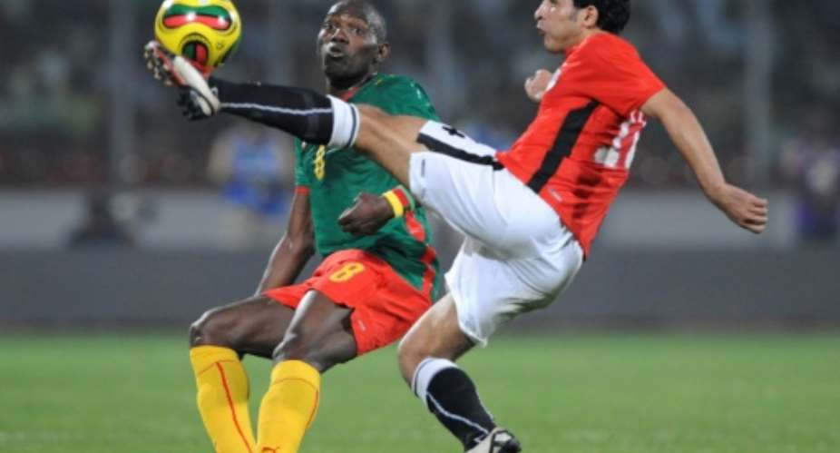 A file picture of now retired Cameroon star Geremi Njitap L playing against Egypt during he 2008 Africa Cup of Nations in Ghana.  By JOE KLAMAR AFP