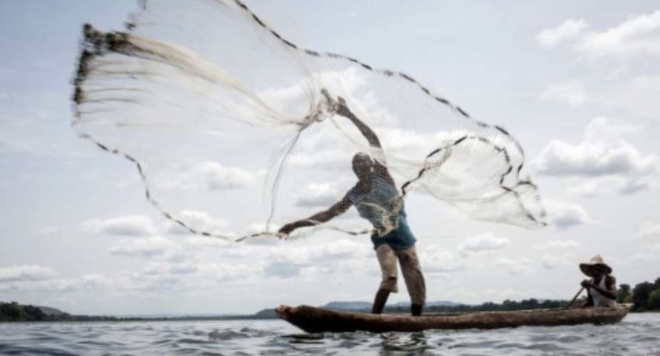 A fisherman, casting his net along the Ubangi River, is one of hundreds to have fled the anti-Balaka militia.  By FLORENT VERGNES AFPFile