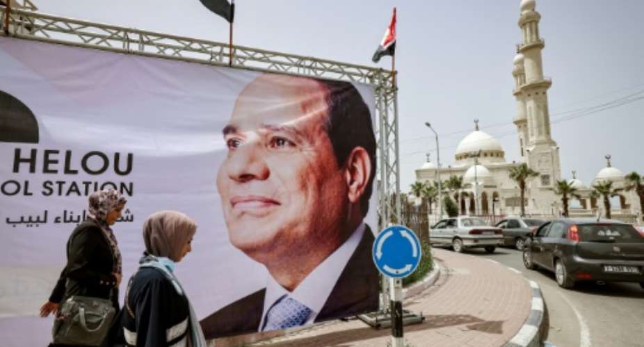 A giant banner depicting Egypt's President Abdel Fattah al-Sisi is seen on display in Gaza City on May 31, 2021.  By MOHAMMED ABED AFPFile
