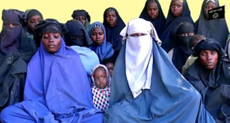 A grab from a video released in January 2018 by Islamist militant group Boko Haram shows some of the schoolgirls abducted from the northeast Nigerian town of Chibok in 2014.  By Handout BOKO HARAMAFPFile