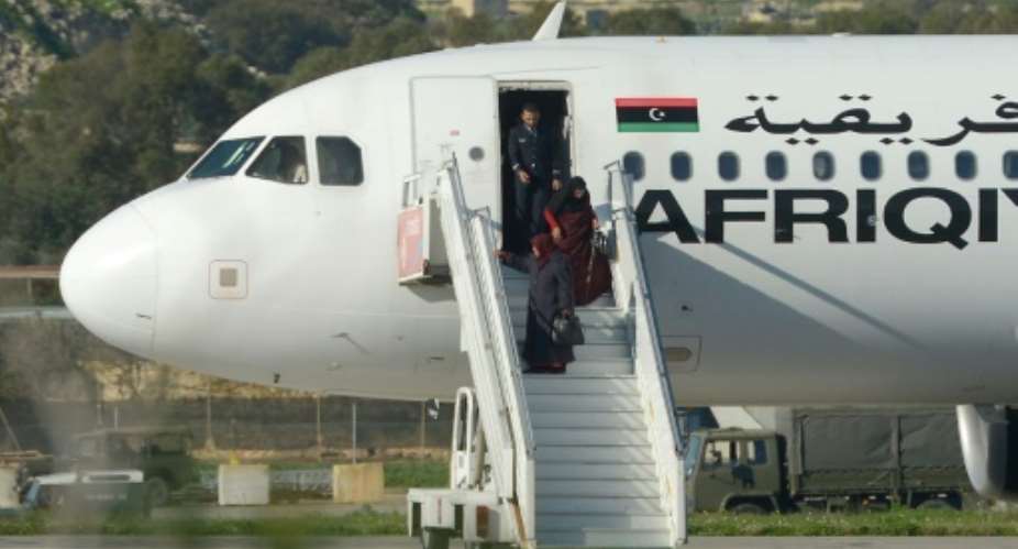 A group of hostages is released from a hijacked Afriqiyah Airways plane in Malta on December 23, 2016.  By Matthew Mirabelli AFP