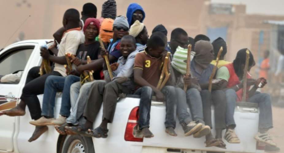 A group of migrants pictured in 2015, leaving Niger for Libya in the hope of reaching Europe.  By ISSOUF SANOGO AFPFile