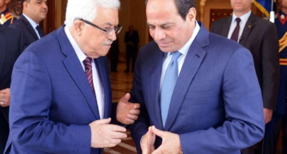 A handout picture provided by the Palestinian Authority's press office PPO shows Egyptian President Abdel Fattah al-Sisi R meeting with Palestinian leader Mahmud Abbas in the capital Cairo on May 9, 2016.  By THAER GHANAIM PPOAFPFile