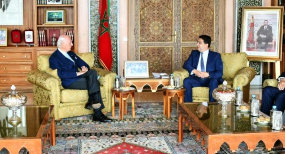 A handout released by the Moroccan foreign ministry shows Morocco's Foreign Minister Nasser Bourita R receiving the UN secretary general's personal envoy for Western Sahara, Staffan de Mistura L in the capital Rabat.  By - Moroccan Ministry of Foreign AffairsAFP