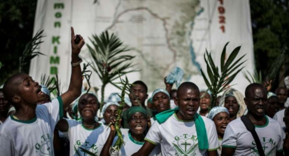 A Kimbanguist choir  in the Democratic Republic of Congo celebrate true Christmas in tribute to Simon Kimbangu Kiangani, held to be the second reincarnation of the Holy Spirit.  By JOHN WESSELS AFP