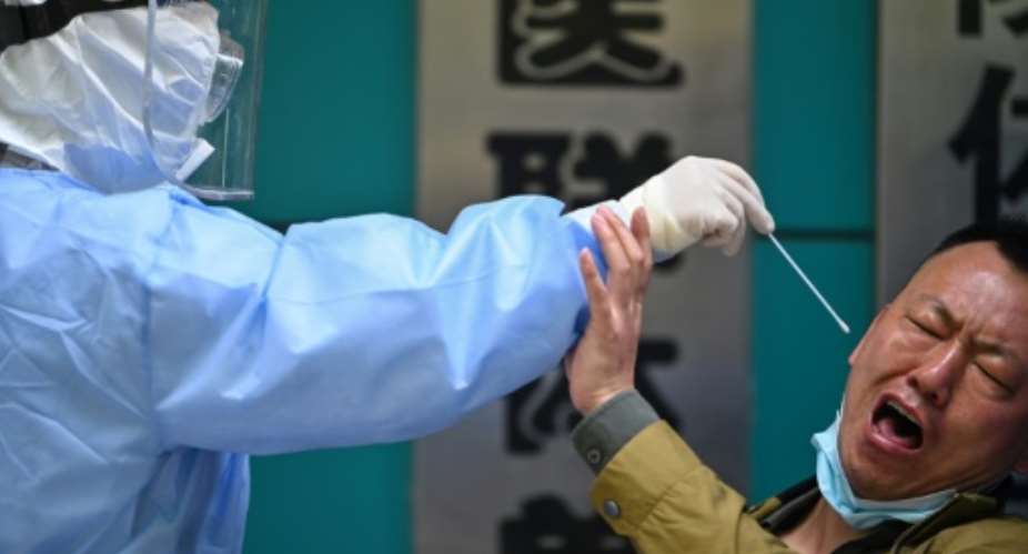 A man is tested in Wuhan, the Chinese city where the coronavirus first emerged.  By Hector RETAMAL AFP