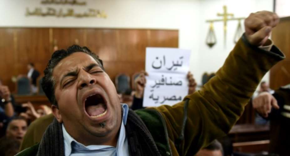 A man reacts on December 19, 2016 at the high administrative court as a judge announces a court ruling in the case of two Red Sea islands in Cairo.  By MOHAMED EL-SHAHED AFPFile