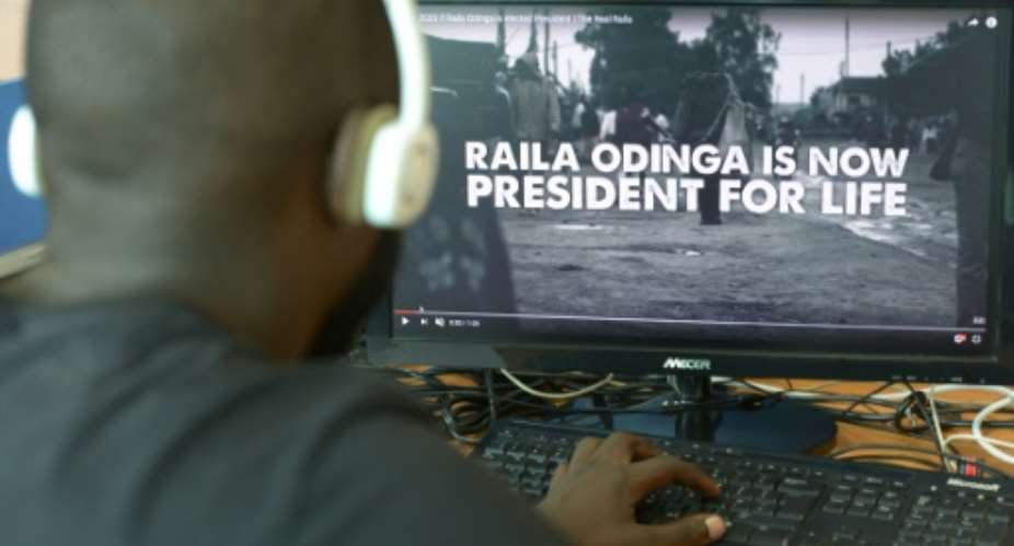 A man watches a hard-hitting online campaign ad just weeks before national elections, in Nairobi on July 13, 2017.  By SIMON MAINA AFP
