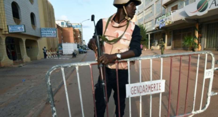 A member of security forces stands in Ouagadougou in August 2017.  By Sia KAMBOU AFPFile