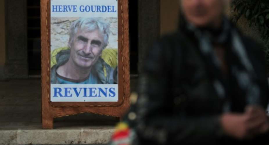 A memorial photograph of murdered mountaineer Herve Gourdel in his hometown in France, in this September 2014 picture. Herve Gourdel, come back, it reads in French.  By Jean-Christophe MAGNENET AFPFile