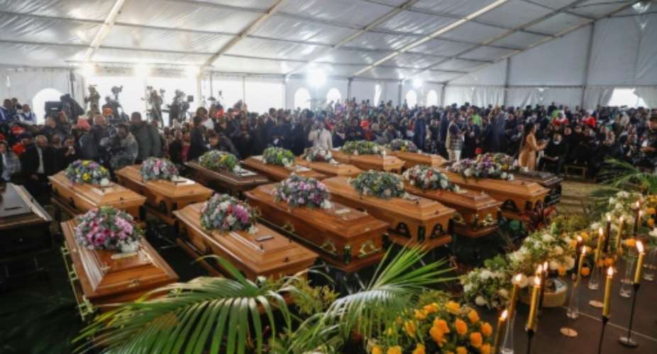 A memorial service for the 21 dead, in which empty coffins were used to symbolise the loss, was held in East London on July 6.  By Phill Magakoe AFP