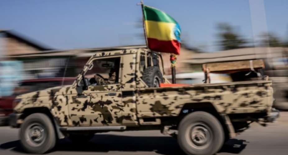 A military vehicle with the national flag is seen in Kombolcha, Ethiopia, on December 11, 2021.  By Amanuel Sileshi AFPFile