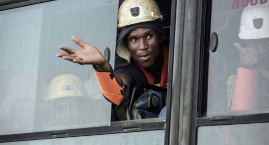 A miner rescued from the Beatrix gold mine in South Africa -- owned by South African goldminer Sibanye-Stillwater -- after a power outage trapped nearly 1,000 miners underground in February 2018.  By GIANLUIGI GUERCIA AFPFile