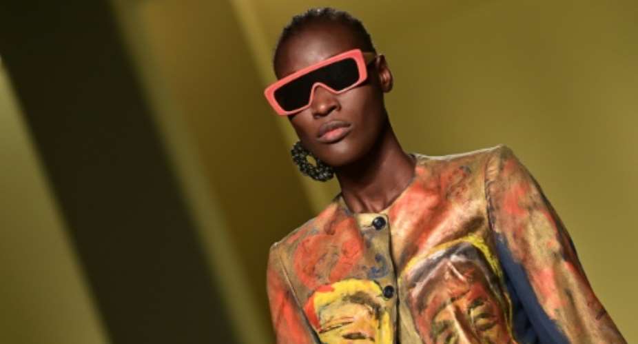 A model presents a creation by Senegalese fashion designer, Pape Mocodou Fall, aka Mokodu from the collective Black Lives Matter in Italian Fashion in Milan during the filming of the fashion show that opened the Milan Fashion Week on  Wednesday..  By MIGUEL MEDINA AFP