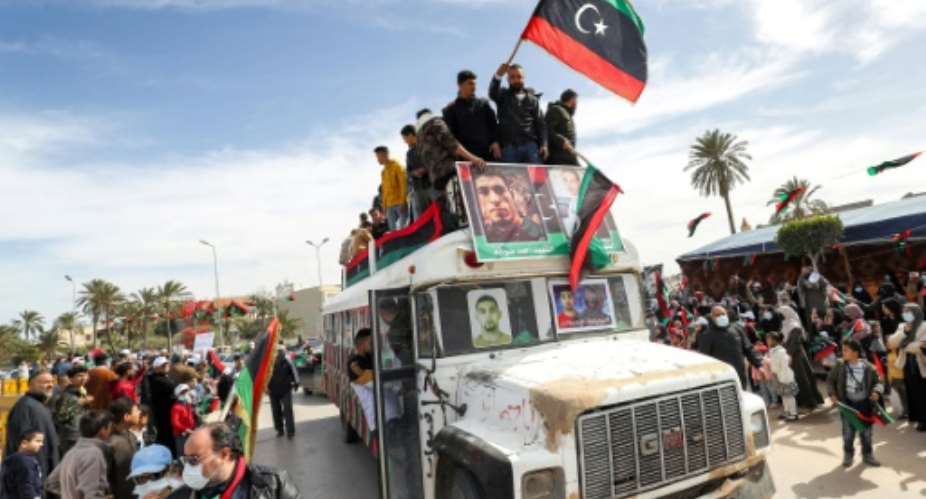 A parade to commemorate the 2011 uprising that toppled Libyan strongman Moamer Kadhafi, in the coastal city of Tajura, east of the capital Tripoli, on February 25, 2022.  By Mahmud Turkia AFPFile