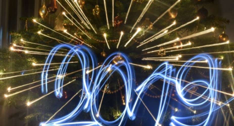 A party atmosphere will sweep across major cities in Asia, Europe, Africa and the Americas as the clock ticks past midnight.  By ATTILA KISBENEDEK (AFP)