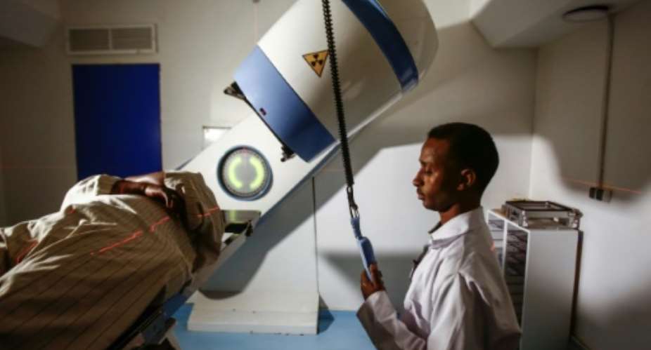 A patient undergoes radiotherapy at Sudan's largest state-run cancer hospital, the Radiation and Isotopes Centre Khartoum, on July 25, 2017.  By ASHRAF SHAZLY AFP
