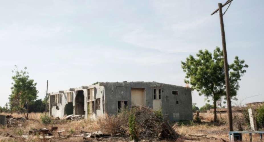 A picture taken on December 8, 2016 in Bama, northeast Nigeria shows one the buildings destoyed by Boko Haram.  By Stefan Heunis (AFP)