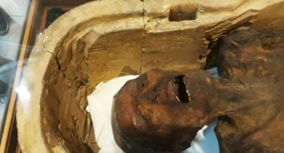 A picture taken on February 14, 2018 shows the Screaming Mummy known scientifically as the unknown man E on display at the Egyptian Museum in Cairo's Tahrir Square.  By KHALED DESOUKI AFP