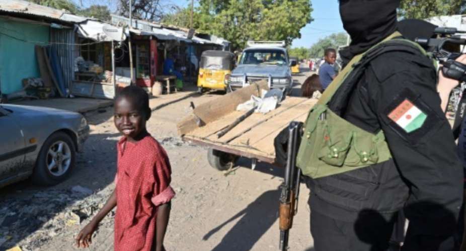 A police officer stands guard on a road near the airport at Diffa, southeastern Niger.  By Issouf SANOGO (AFP)