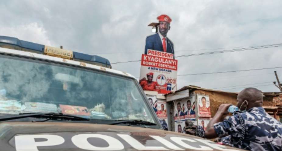 A police patrol car stationed outside the headquarters of Uganda's main oppposition party, the National Unity Platform.  By SUMY SADURNI AFP