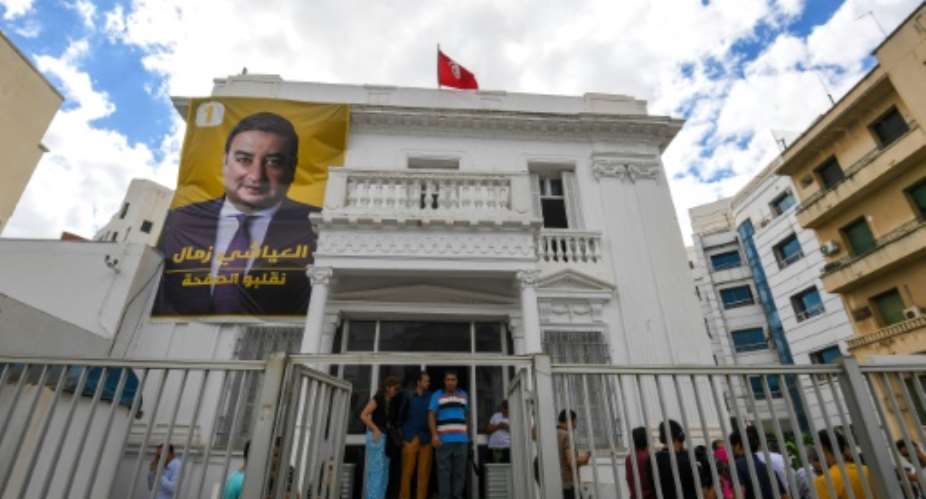 A poster of Ayachi Zammel at his electoral headquarters in Tunis on September 16.  By FETHI BELAID (AFP)