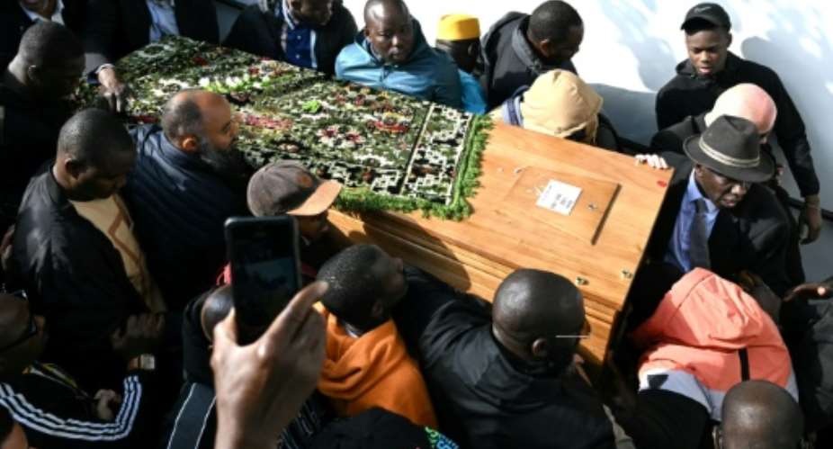 A prayer ceremony was held in Mali to honour Aboubakar Cisse.  By Bertrand GUAY (AFP)