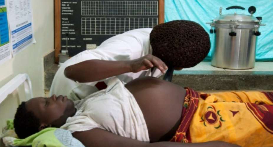 A pregnant woman in eastern Uganda receives the sort of prenatal care that UNICEF says can prove crucial to a newborn's chances of survival.  By MICHELE SIBILONI AFPFile