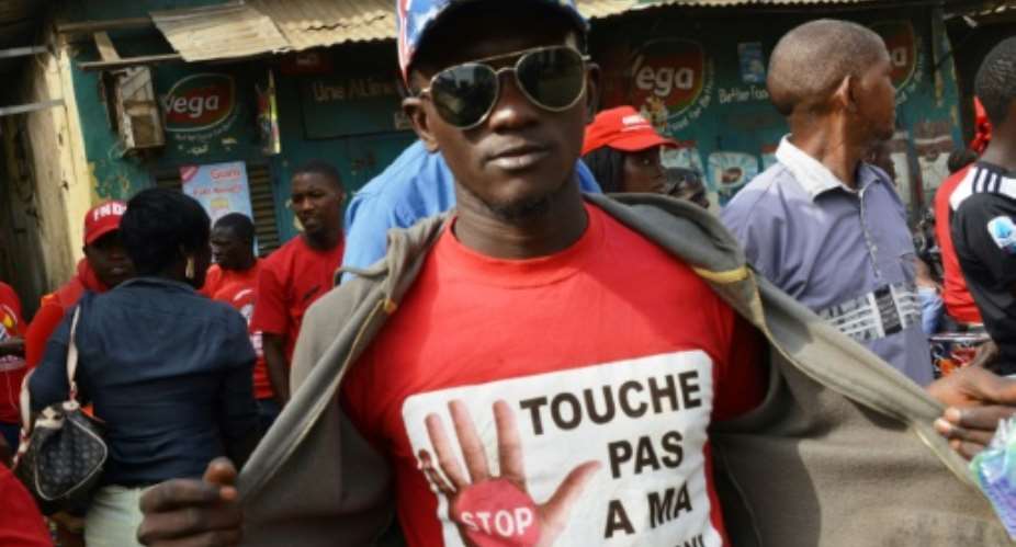 A protestor at a January rally wears a T-shirt reading 'Don't Touch My Constitution!' Conde's proposal to change the constitution has been hugely controversial.  By CELLOU BINANI AFPFile