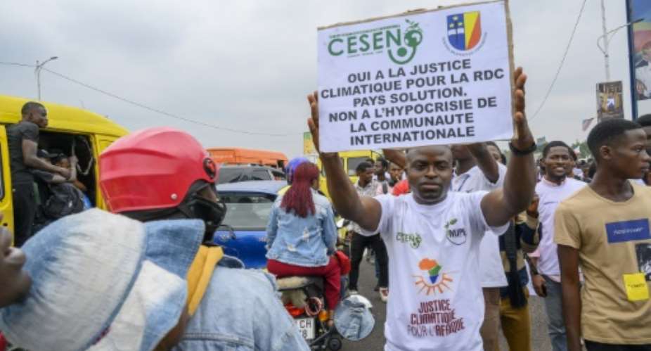 A protestor in Kinshasa accuses the world of climate 'hypocrisy'.  By Arsene Mpiana AFP