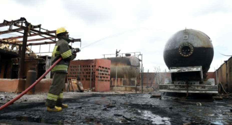 A running generator inside the gas depot was suspected of causing a spark that triggered the blast.  By PIUS UTOMI EKPEI AFP