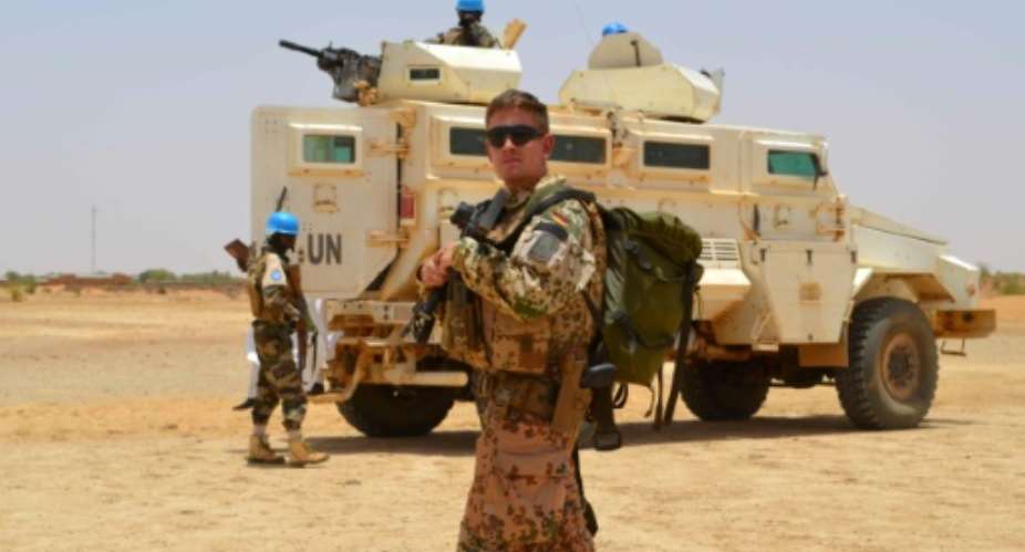 A Sahel force will have its headquarters in Mali but will be under a separate command from the UN peacekeeping force MINUSMA, a German solider of which is seen in April 2017, which has been deployed in the country since 2013.  By Souleymane AG ANARA AFPFile