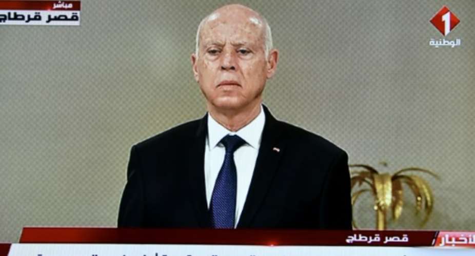 A screen grab from Tunisian television shows President Kais Saied announcing the formation of a new government on Monday.  By - AFP