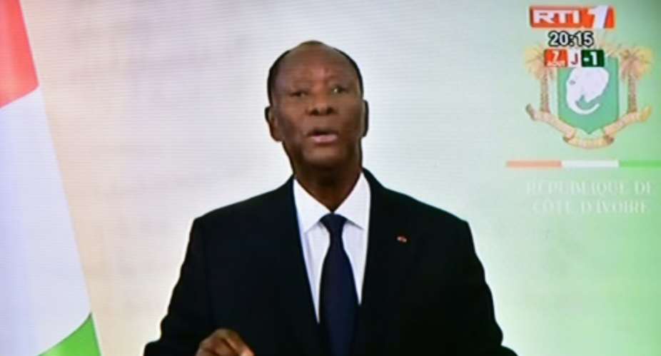 A screen shot showing resident Alassane Ouattara addressing the nation on Monday.  By ISSOUF SANOGO AFP