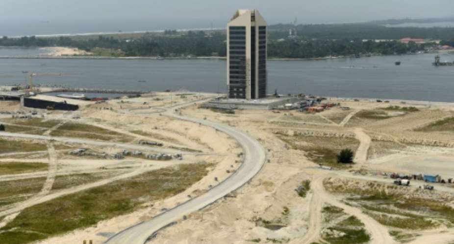 A skyscraper under construction at Eko Atlantic City, Lagos, billed as the largest real estate project in Africa, where frenetic construction has slowed to a snail's pace.  By Pius Utomi Ekpei AFP