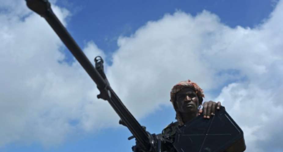 A Somali soldier holds a machine gun at a military base in this 2018 file photo.  By Mohamed ABDIWAHAB AFPFile