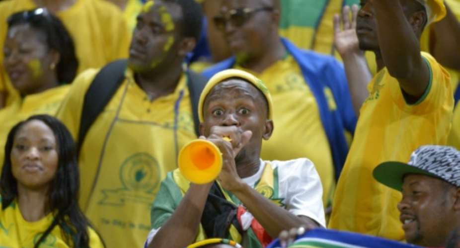 A South African Mamelodi Sundowns' football club fan blows a vuvuzela prior to the start of the CAF Champions League final match on October 23, 2016 at the Army stadium in Borg el-Arab, near Alexandria.  By  AFP