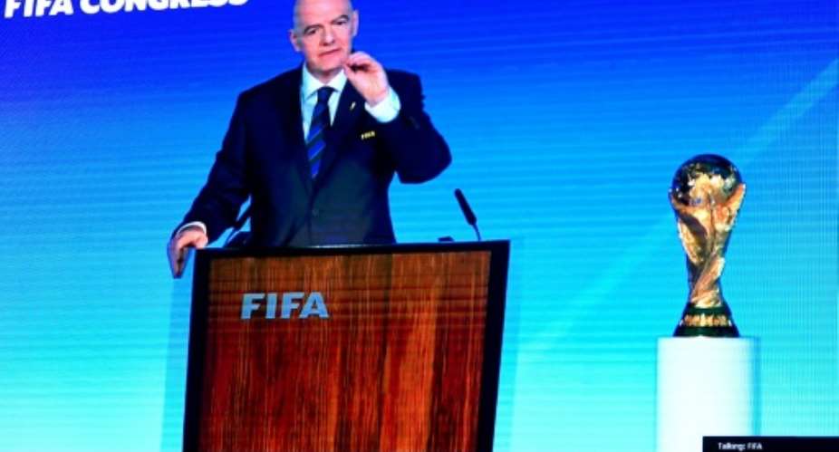 A speech by FIFA president Gianni Infantino is broadcast on a screen in Saudis capital Riyadh as the Gulf kingdom is confirmed as 2034 World Cup host.  By - (AFP)