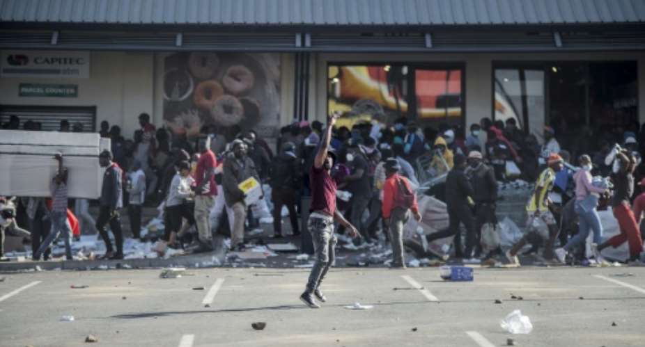 A spree of arson and looting rocked parts of South Africa in July following the jailing of ex-president Jacob Zuma for contempt after he refused to appear before graft investigators.  By LUCA SOLA (AFP/File)