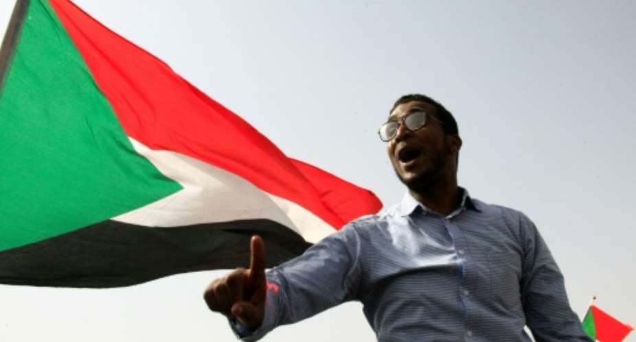 A Sudanese protester chants slogans in the capital Khartoum's Green Square on July 18, 2019, during a rally to honour comrades killed in the months-long protest movement that has rocked the country.  By Ebrahim HAMID AFPFile