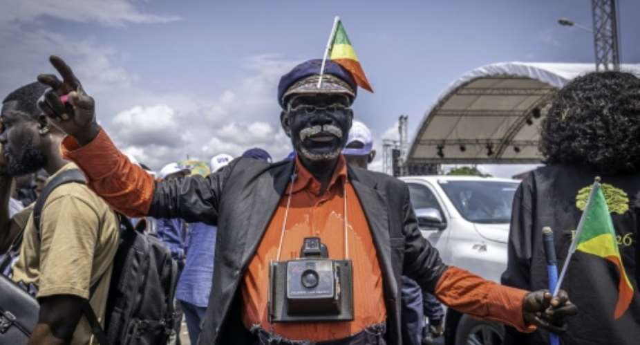 A supporter of Sassou Nguesso at a campaign rally in Pointe-Noire.  By Glody MURHABAZI (AFP)
