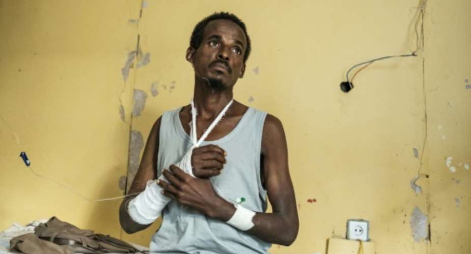 A survivor of the massacre in the town of Mai-Kadra, the worst-known attack on civilians during Ethiopia's ongoing internal conflict pitting federal forces against leaders of Tigray's ruling party.  By EDUARDO SOTERAS AFP