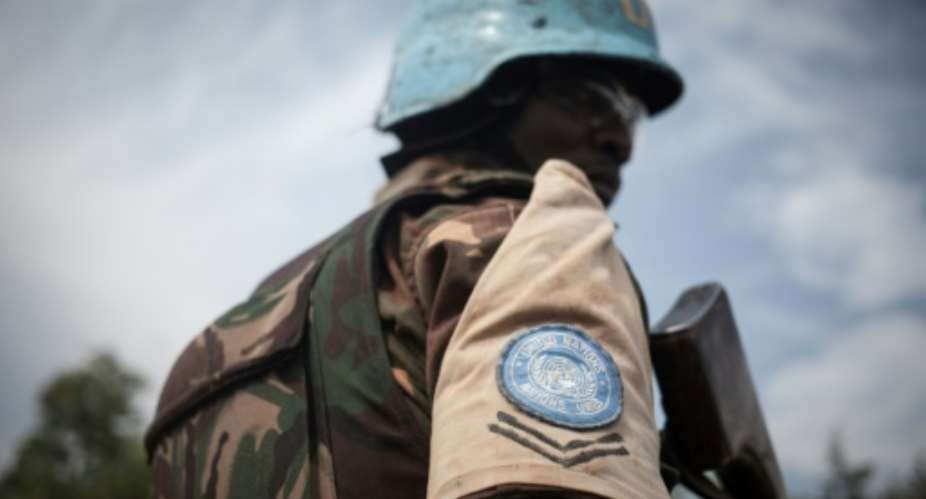 A Tanzanian soldier from the UN peacekeeping mission in the Central African Republic patrols the town of Gamboula on July 6.  By FLORENT VERGNES AFP