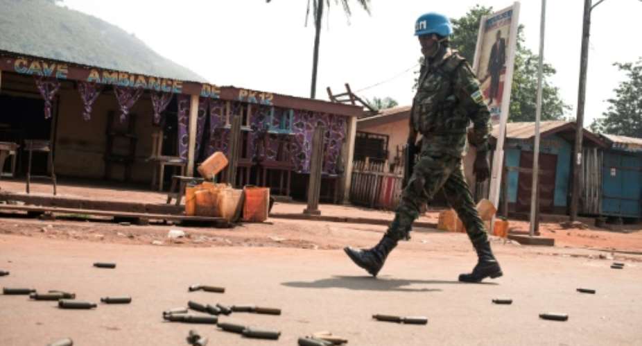A UN peacekeeper patrols an an area known as PK12 outside Central Africa's Republic's capital Bangui after a rebel attack.  By FLORENT VERGNES AFP