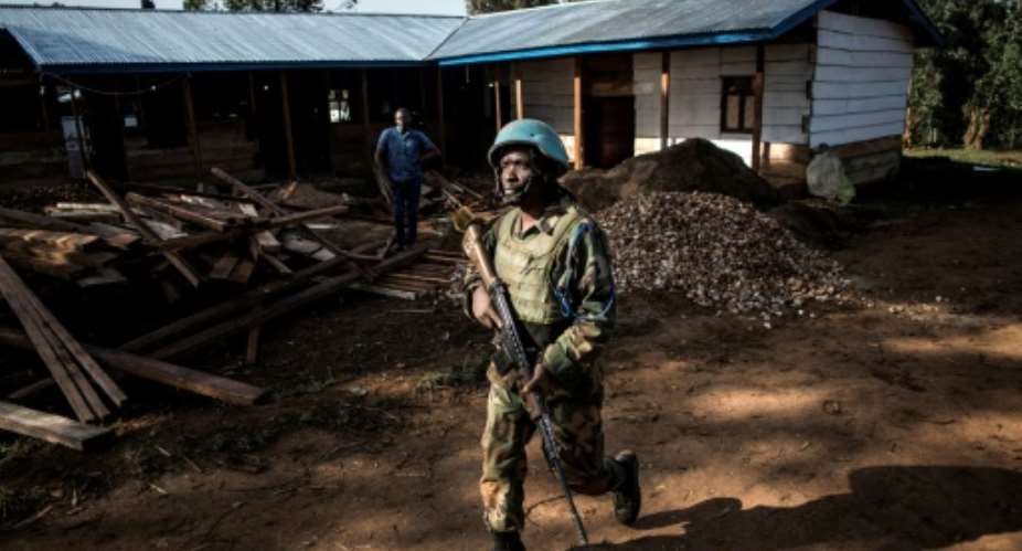 A UN peacekeeper patrols outside an Ebola treatment centre in Butembo in northeastern Democratic Republic of Congo.  By JOHN WESSELS AFPFile