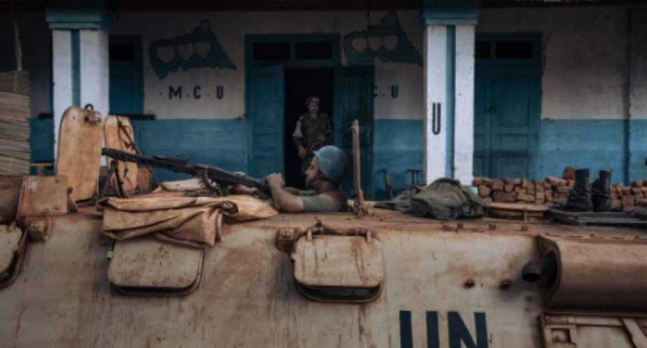 A UN peacekeeper patrols the Central African Republic city of Bangassou, which was seized by rebels.  By ALEXIS HUGUET AFP