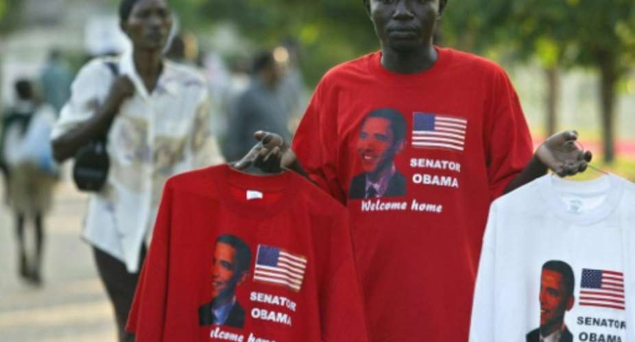 A vendor in Kisumu, Kenya, sells tee-shirts bearing the photo of then US senator Barack Obama.  By Simon Maina AFPFile